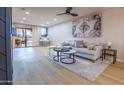Bright living room with sliding glass doors and comfortable seating area at 4303 E Cactus Rd # 128, Phoenix, AZ 85032