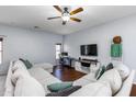 Inviting living room with a ceiling fan, hardwood floors, and lots of natural light at 923 E Randy St, Avondale, AZ 85323