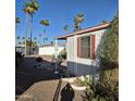 Single-story home featuring a gravel backyard and a patio, perfect for outdoor relaxation at 303 S Recker Rd # 98, Mesa, AZ 85206