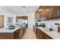 Kitchen featuring a center island and stainless steel appliances at 15044 W Gray Fox Trl, Surprise, AZ 85387
