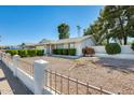 A single-story home features desert landscaping for low maintenance and easy living at 15608 N 57Th Dr, Glendale, AZ 85306