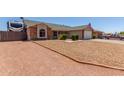 Well-maintained single Gathering home featuring gravel landscaping and an RV parking area at 1925 W 12Th Ave, Apache Junction, AZ 85120