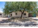 Charming home with mature shade tree enhancing curb appeal and providing a cool, inviting setting at 2129 N Summer St, Mesa, AZ 85203