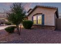 A well maintained single story home with blue shutters and a manicured lawn at 2236 W Aston Dr, San Tan Valley, AZ 85144
