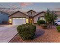 Charming single-story home featuring a well-manicured yard, a two-car garage, and inviting front entrance at 2236 W Aston Dr, San Tan Valley, AZ 85144