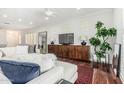 Bright living room features hardwood floors, plush seating, and ample natural light at 2542 E Los Alamos St, Gilbert, AZ 85295