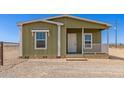 Charming single story home with a cozy front porch and classic architectural details at 32650 N 223Rd Dr, Wittmann, AZ 85361
