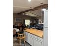 Open-concept living space with exposed beams and natural light at 3330 E Main St # 448, Mesa, AZ 85213