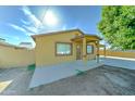 A single-story house featuring a covered porch and desert landscaping at 42 S Vineyard --, Mesa, AZ 85210