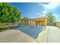 Single-story house with covered parking and a spacious driveway at 42 S Vineyard --, Mesa, AZ 85210