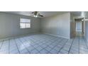 Bright, airy living room featuring tile flooring and a ceiling fan at 42 S Vineyard --, Mesa, AZ 85210