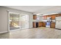 Bright kitchen features wood cabinets, stainless steel appliances, and sliding glass door at 6625 N 44Th Ave, Glendale, AZ 85301