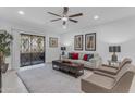Comfortable living room featuring plush seating, a ceiling fan, and bright, natural light at 7777 E Main St # 215, Scottsdale, AZ 85251