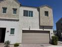 Charming two-story townhome with a two-car garage and well-maintained landscaping at 8330 N 22Nd Ln, Phoenix, AZ 85021