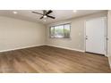 Bright living room featuring ceiling fan, neutral walls, and wood-look floors at 915 E Commonwealth Pl, Chandler, AZ 85225