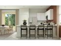 Bright and airy kitchen with a breakfast bar and ample counter space at 9830 W Pinchot Ave, Phoenix, AZ 85037
