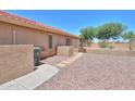The private backyard is xeriscaped and provides privacy at 103 S Birdie Way, Casa Grande, AZ 85194