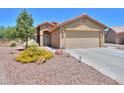 Attractive single-story home featuring desert landscaping and a two-car garage at 103 S Birdie Way, Casa Grande, AZ 85194