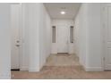 Inviting foyer with tile flooring, neutral walls, and a well-lit entrance, creating a welcoming atmosphere at 11015 E Texas Ave, Mesa, AZ 85212