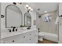 Updated bathroom features dual sinks, quartz counters, and tiled tub/shower combo at 132 W Orchid Ln, Chandler, AZ 85225