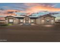 Charming one-story home with desert landscaping, neutral palette and inviting front entrance at 28848 W Grand Ave, Wittmann, AZ 85361