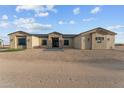 Stunning single-story home with manicured gravel yard and modern architectural details at 28848 W Grand Ave, Wittmann, AZ 85361