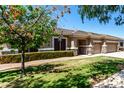 Single Gathering house with mature trees and a manicured front yard offers great curb appeal at 3006 E Lexington Ave, Gilbert, AZ 85234