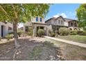 Inviting two-story home with a charming front yard and walkway at 3036 N Acacia Way, Buckeye, AZ 85396