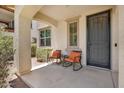 Cozy front porch with seating, offering a relaxing outdoor space at 3036 N Acacia Way, Buckeye, AZ 85396
