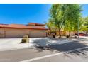 Appealing single-story house showcases a three-car garage, desert landscaping, and a classic Southwestern style at 4772 W Joshua Blvd, Chandler, AZ 85226