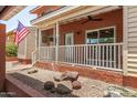 Charming porch with cozy seating area and patriotic flag at 6454 E Paso Nuevo Dr # 104, Cave Creek, AZ 85331
