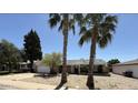 Traditional ranch home featuring desert landscaping and mature trees, perfect for outdoor living at 8257 E Cypress St, Scottsdale, AZ 85257