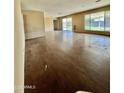 Spacious living room with wood floors and sliding glass doors leading to the backyard at 8257 E Cypress St, Scottsdale, AZ 85257
