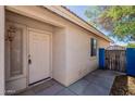 Exterior view of the front door and gated side yard entrance at 8660 E Nido Ave, Mesa, AZ 85209