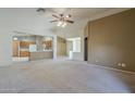 Spacious, open-concept living area with carpet flooring at 8660 E Nido Ave, Mesa, AZ 85209