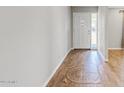 Inviting entryway with beautiful decorative tile inlay and wood-look flooring at 1050 W 9Th Pl, Mesa, AZ 85201
