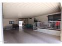 Spacious covered carport area perfect for outdoor dining and entertaining with ample seating and a large deck at 111 S Greenfield -- # 602, Mesa, AZ 85206
