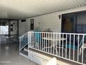 Cozy covered carport featuring a charming deck with white railings, ideal for relaxing and enjoying the outdoors at 111 S Greenfield -- # 602, Mesa, AZ 85206