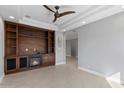 Spacious living room with custom built-ins, fireplace, and neutral color palette at 11342 E Laguna Azul Cir, Mesa, AZ 85209