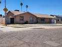 Lovely one-story home featuring desert landscaping, a paved driveway, and a secure gated entrance at 1602 N 57Th Ave, Phoenix, AZ 85035