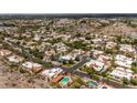 An elevated view showcases the property's neighborhood, nearby community and scenic mountain backdrop at 1925 E Lane Ave, Phoenix, AZ 85020