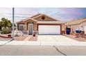 Cozy single-story home with a well-kept front yard, desert landscaping, and a two-car garage at 1943 E San Tan St, Chandler, AZ 85225