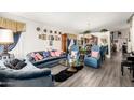 Comfortable living room featuring plush blue sofas, a glass coffee table, and decorative accents at 1943 E San Tan St, Chandler, AZ 85225