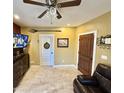 Cozy living room featuring tile flooring, dark wood accents, and neutral paint at 2014 N 17Th Pl, Phoenix, AZ 85006
