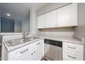 Kitchen sink and granite countertops with stainless steel dishwasher at 2025 E Campbell Ave # 137, Phoenix, AZ 85016