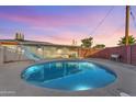 Private backyard oasis featuring a sparkling pool, a slide and ample space for outdoor relaxation and enjoyment at 2234 N 74Th Way, Scottsdale, AZ 85257