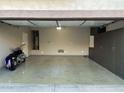 Spacious two car garage with epoxy flooring and built in storage at 28306 N 25Th Dl, Phoenix, AZ 85085