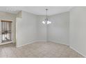 Bright dining area with tiled floors and a stylish light fixture at 2861 E Morenci Rd, San Tan Valley, AZ 85143