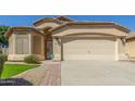 Charming single-story home featuring a two-car garage and a well-maintained landscaped front yard at 29049 N Coal Ave, San Tan Valley, AZ 85143