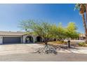 Beautiful single-Gathering home with mature trees, an attached two-car garage, and a spacious front yard at 3061 W Betty Elyse Ln, Phoenix, AZ 85053